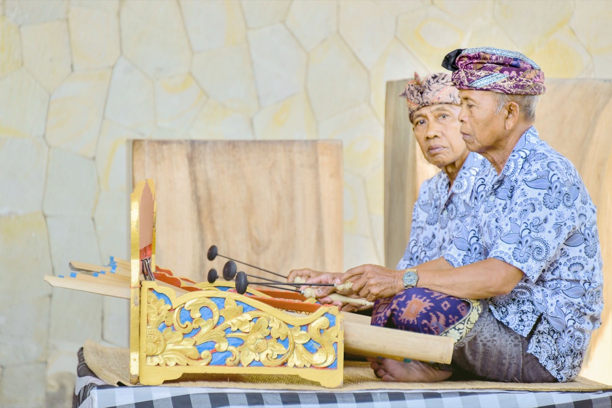 Students playing gamelan instruments in Bali