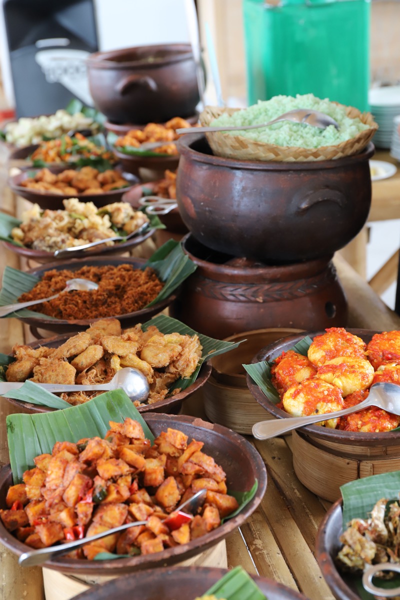 A shared Balinese meal prepared for megibung in Bali