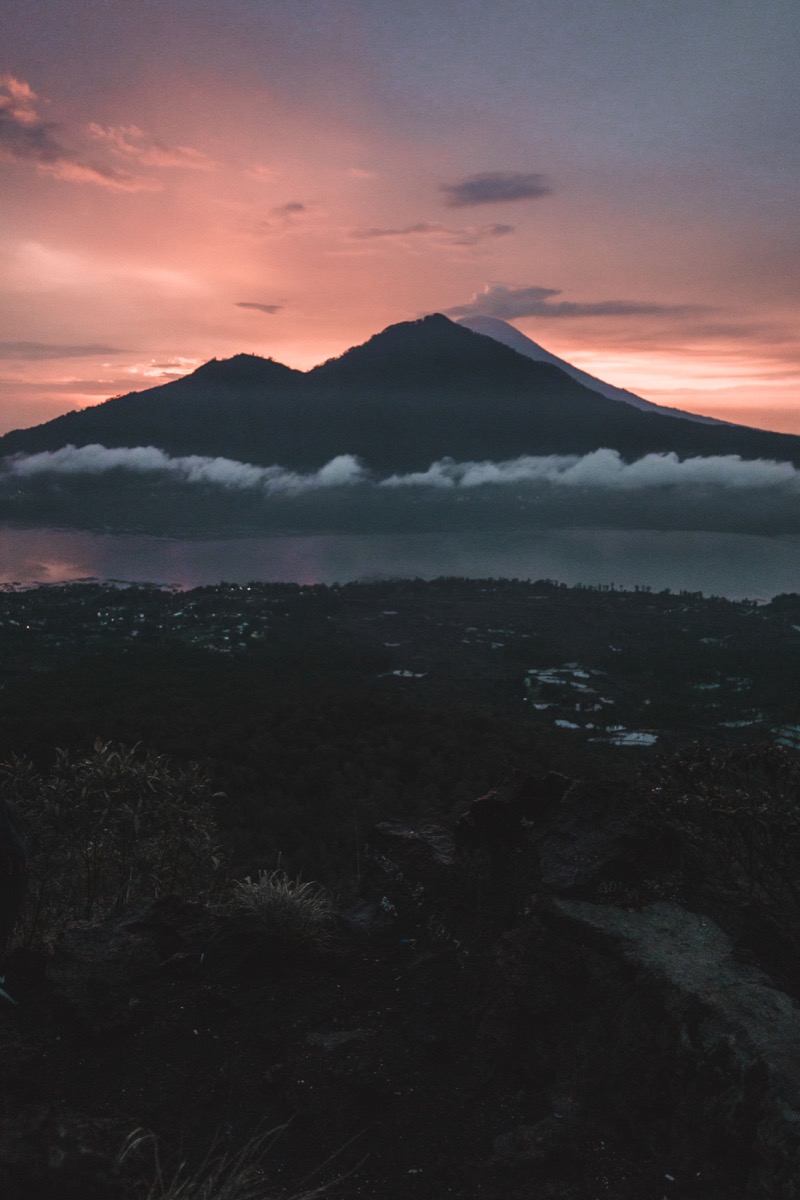 Mount Batur rising above the landscape at sunrise in Bali