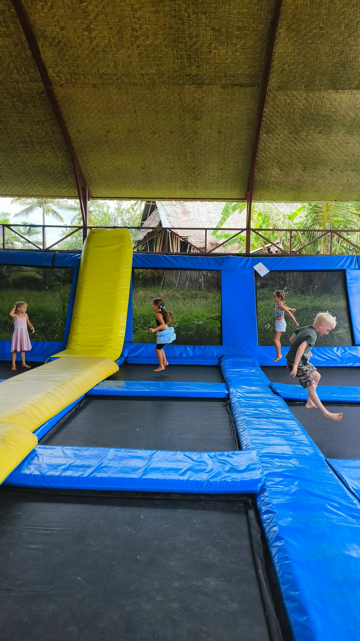 Children playing on the trampoline park at Empathy School Bali